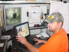 An operator running the CCTV inspection equipment.