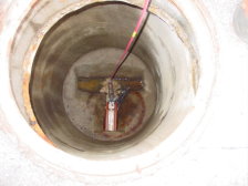 A CCTV sewer pipeline inspection camera in a sewer manhole.